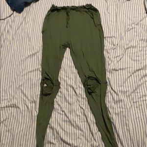 Green pants with knees cut